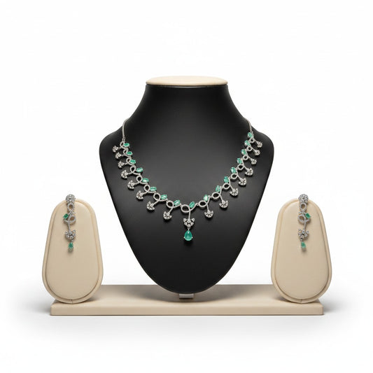 AVIRI emerald and diamond necklace and earring set in sterling silver with pear-shaped emeralds and brilliant-cut diamonds.
