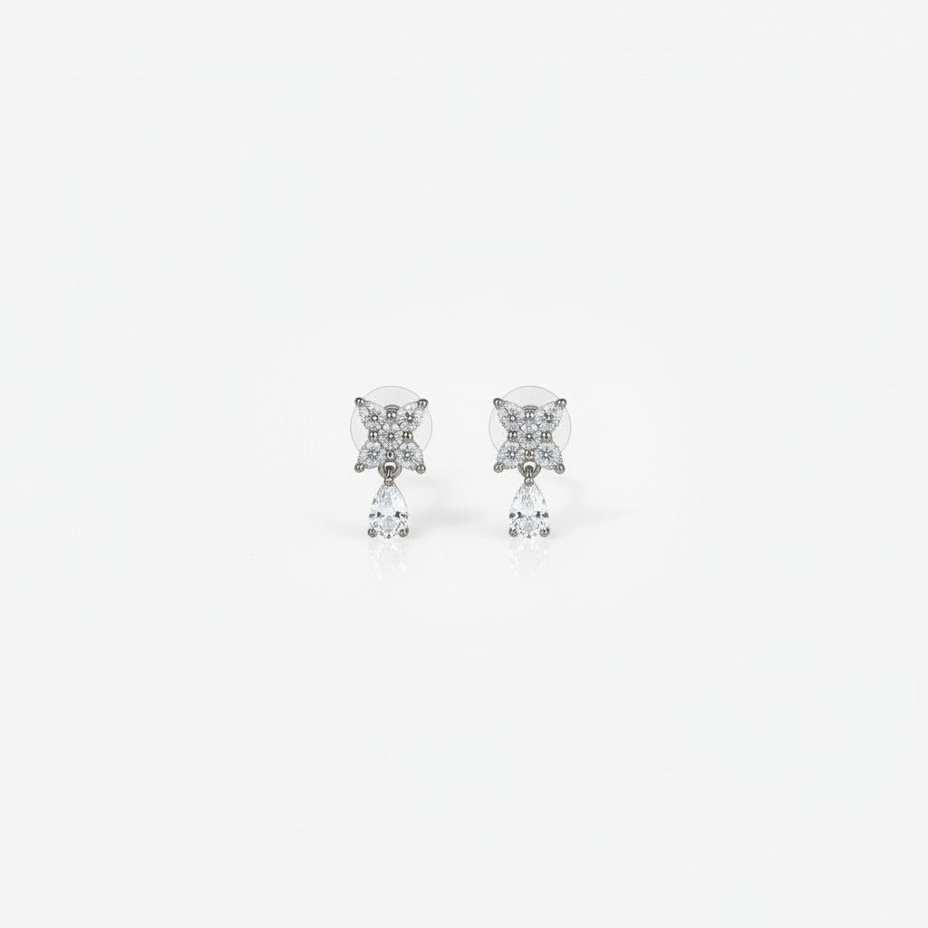 AVIRI floral drop earrings with pear shaped blue gemstones and cubic zirconia in silver-tone metal.