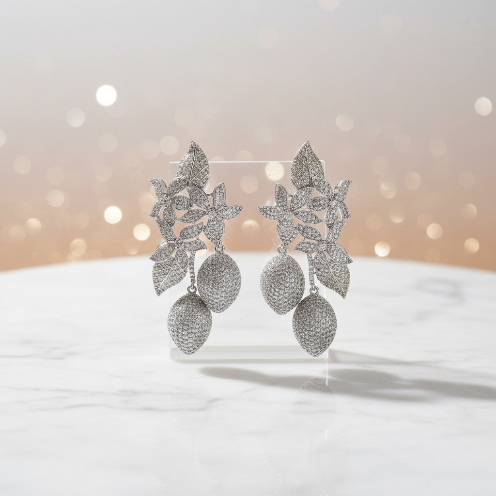 AVIRI silver-tone floral drop earrings with sparkling cubic zirconia and textured spherical pendants.