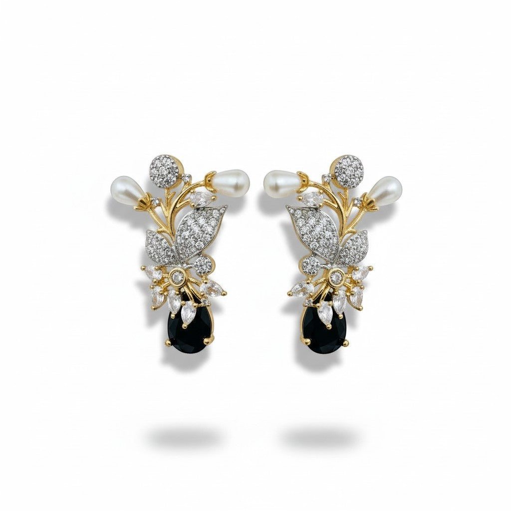 AVIRI floral brooch with pearls, cubic zirconia, and black onyx gemstone. Gold and silver tone.