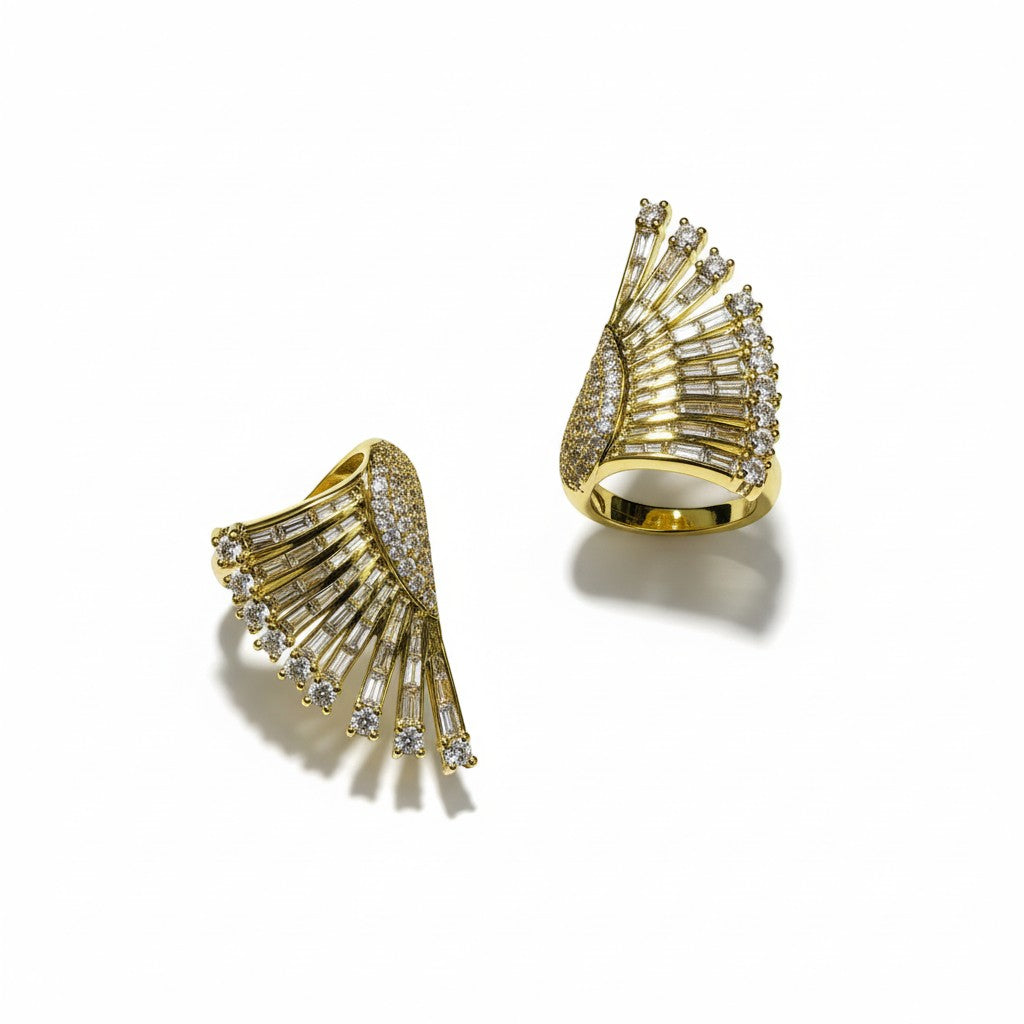 AVIRI gold fan-shaped ring with baguette and round-cut cubic zirconia stones. Statement jewelry.