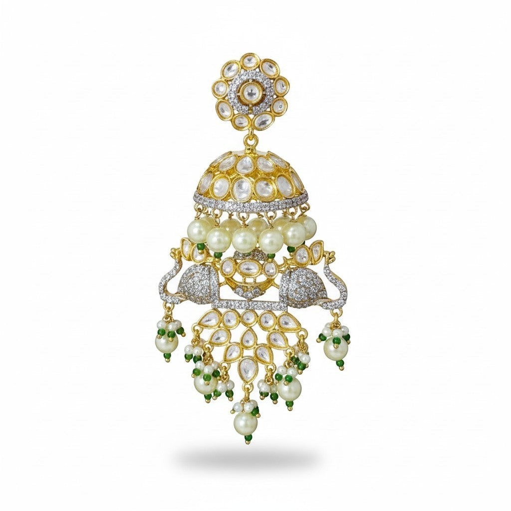 AVIRI gold-plated jhumka earrings with peacock motifs, white stones, pearls, and green beads.