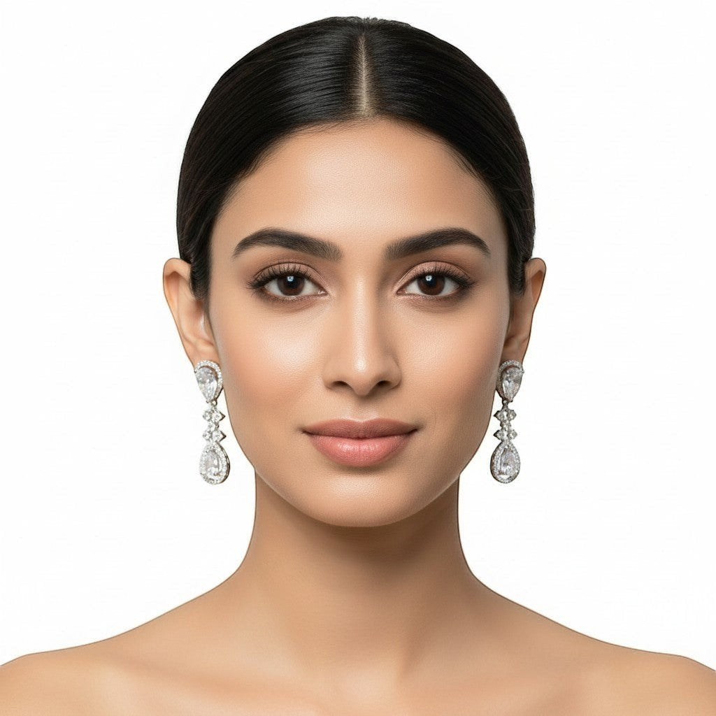 AVIRI silver polished drop earrings with teardrop American diamonds, perfect for women's formal wear.