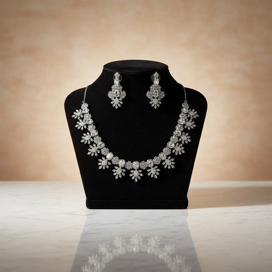 AVIRI sparkling floral necklace and earring set with cubic zirconia stones in silver-tone alloy.