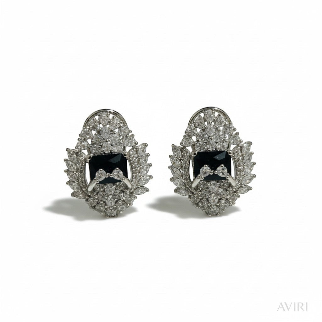 AVIRI black AD stud earrings with silver polish finish and halo of clear stones. Elegant artificial jewelry.