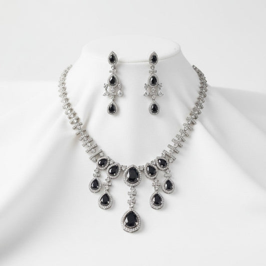 AVIRI black gemstone and silver necklace and earring set with sparkling accents. Elegant cascade design.