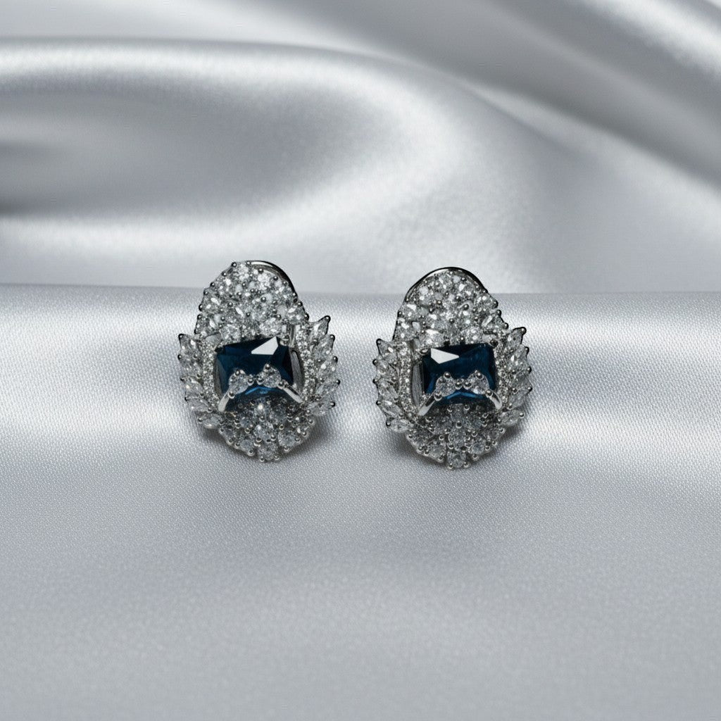 AVIRI luxury blue AD stud earrings with silver polish and halo effect, perfect for special occasions.
