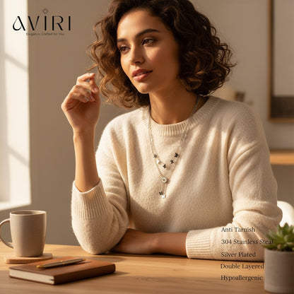 AVIRI silver plated double layered necklace with butterfly charms and a central circular pendant. Hypoallergenic and anti-tarnish.
