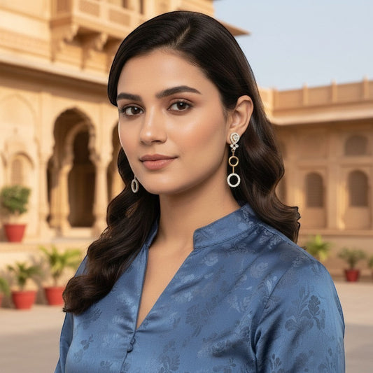 AVIRI designer gold and silver finish AD drop earrings with circular design and clear stones. Lightweight artificial jewelry.