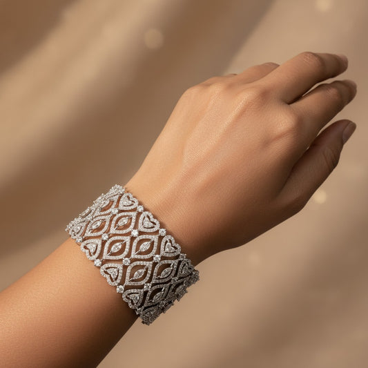 AVIRI diamond lace cuff bracelet with heart motifs in white gold, featuring marquise and round-cut diamonds.