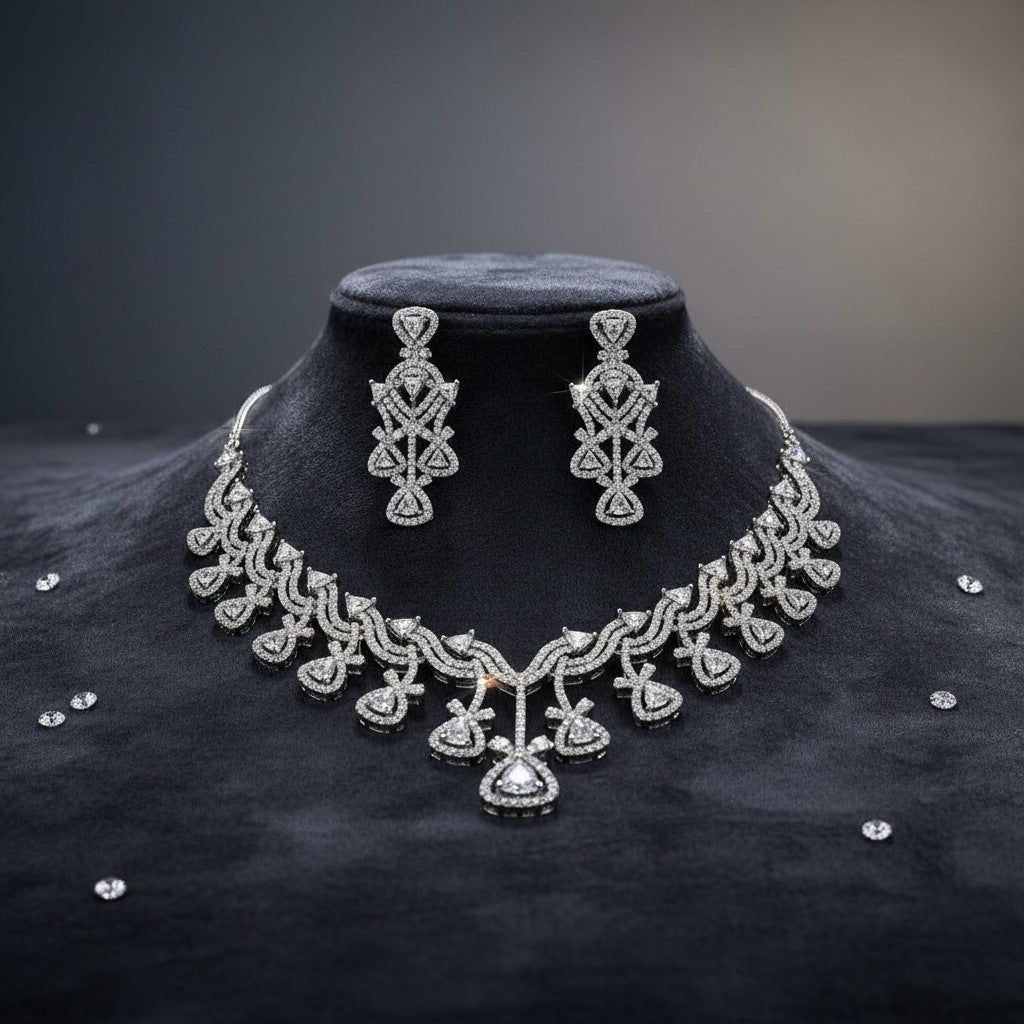 AVIRI diamond necklace and earring set with geometric pattern, crafted in lustrous metal with sparkling stones.