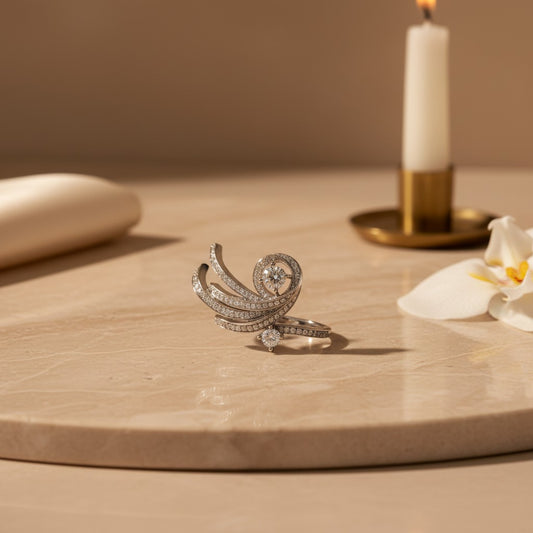 AVIRI sterling silver statement ring with swirling design adorned with cubic zirconia stones.