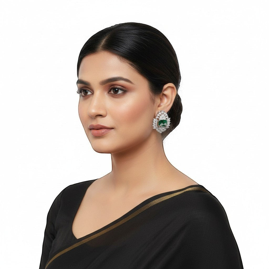 AVIRI luxury emerald green AD stud earrings with silver polish finish and halo of sparkling stones.