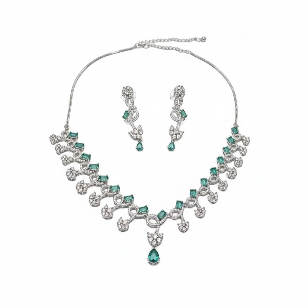 AVIRI emerald and crystal necklace and earring set with silver-tone metal, featuring emerald-cut green stones and clear crystals.