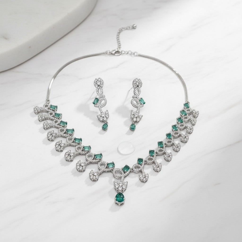 AVIRI silver-tone necklace and earring set with emerald-cut green stones and clear crystals.