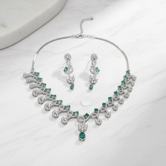 AVIRI silver-tone necklace and earring set with emerald-cut green stones and clear crystals.