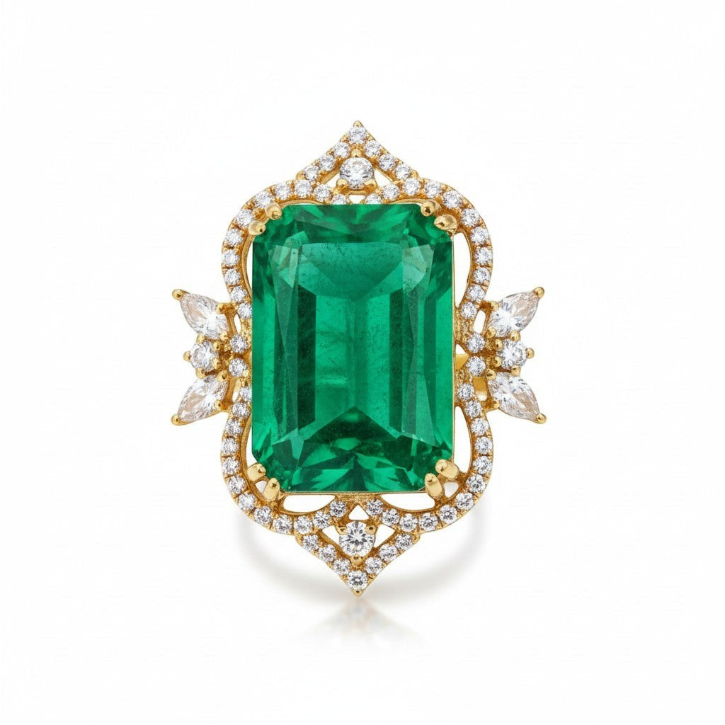 AVIRI emerald-cut green gemstone ring with diamond accents in 14k yellow gold. Cocktail ring with intricate detailing.