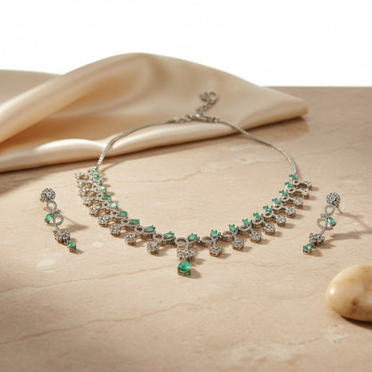 AVIRI sterling silver necklace and earring set with emeralds and diamonds. Pear-shaped emeralds and brilliant-cut diamonds.