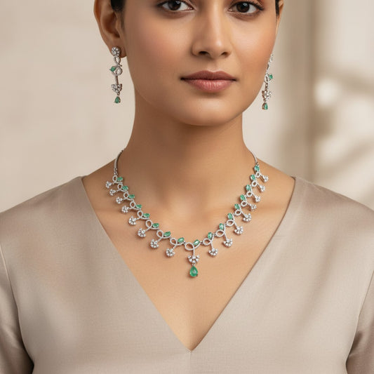 AVIRI emerald and diamond necklace and earring set in sterling silver with pear-shaped emeralds and brilliant-cut diamonds.
