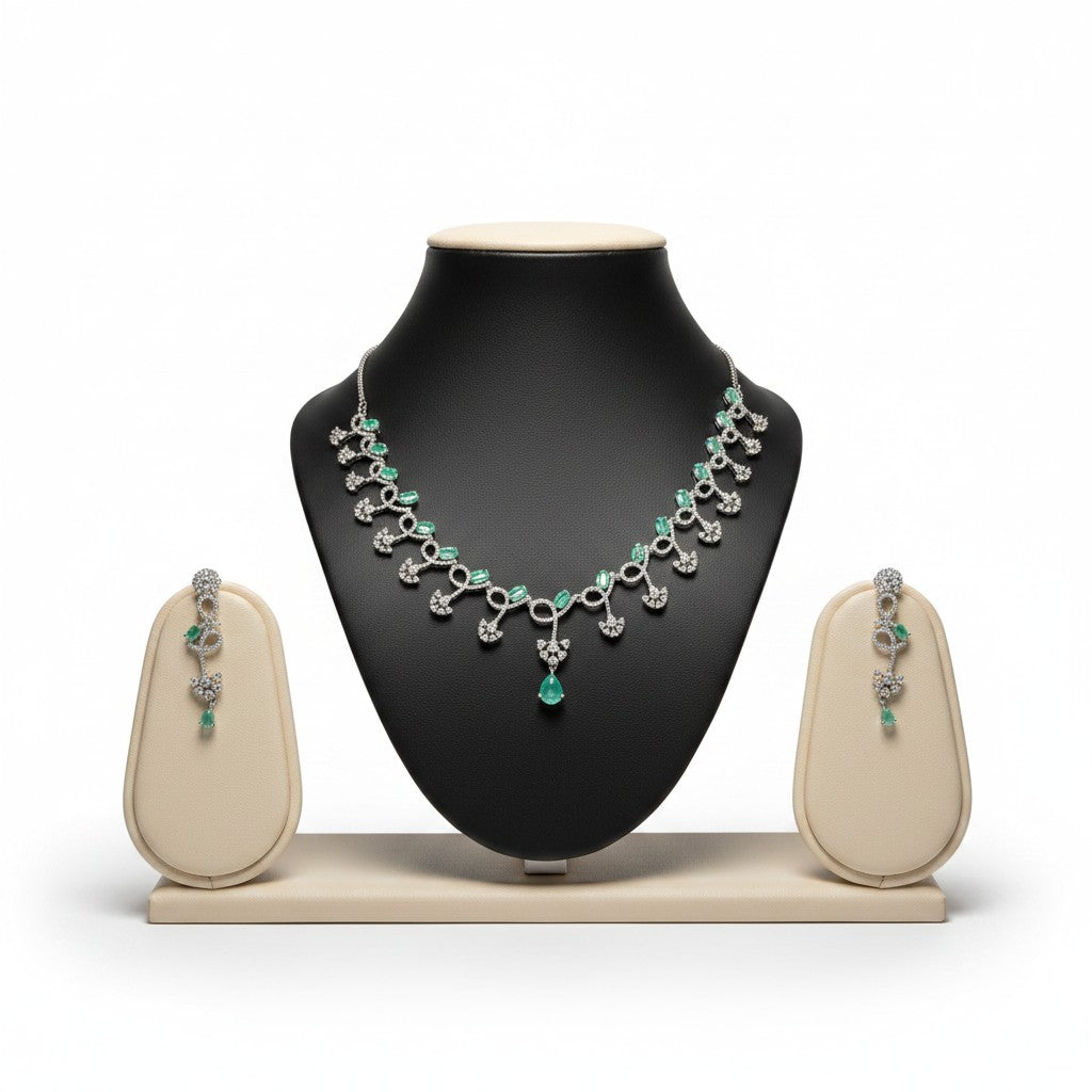 AVIRI emerald and diamond necklace and earring set in sterling silver with pear-shaped emeralds and brilliant-cut diamonds.