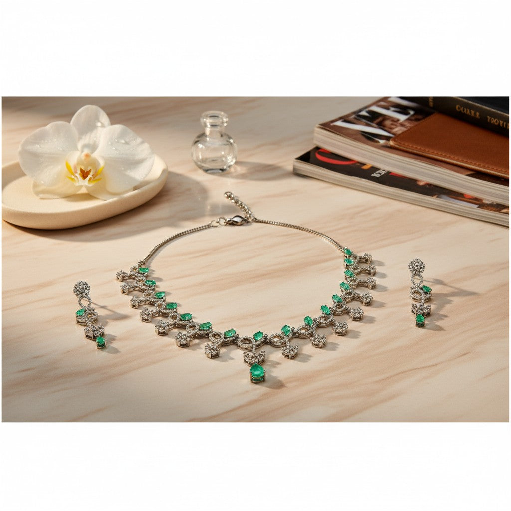AVIRI emerald and diamond necklace and earring set in sterling silver with pear-shaped emeralds and brilliant-cut diamonds.