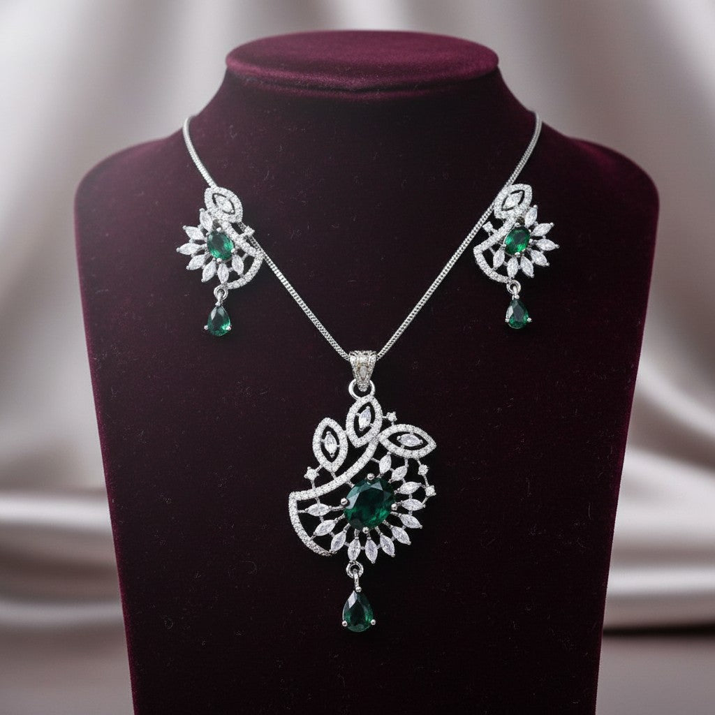 AVIRI emerald green gemstone pendant necklace and earring set with cubic zirconia in silver-tone metal.