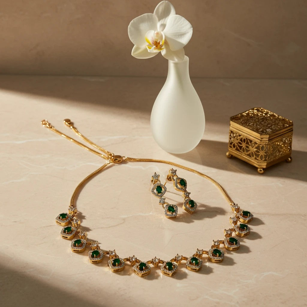AVIRI gold-tone necklace and earring set with emerald-cut green stones and clear crystals.