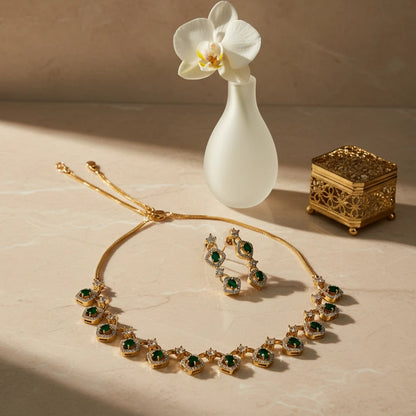 AVIRI gold-tone necklace and earring set with emerald-cut green stones and clear crystals.