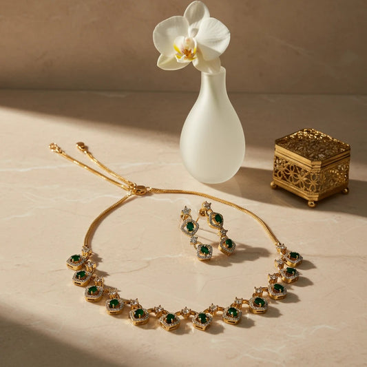 AVIRI gold-tone necklace and earring set with emerald-cut green stones and clear crystals.