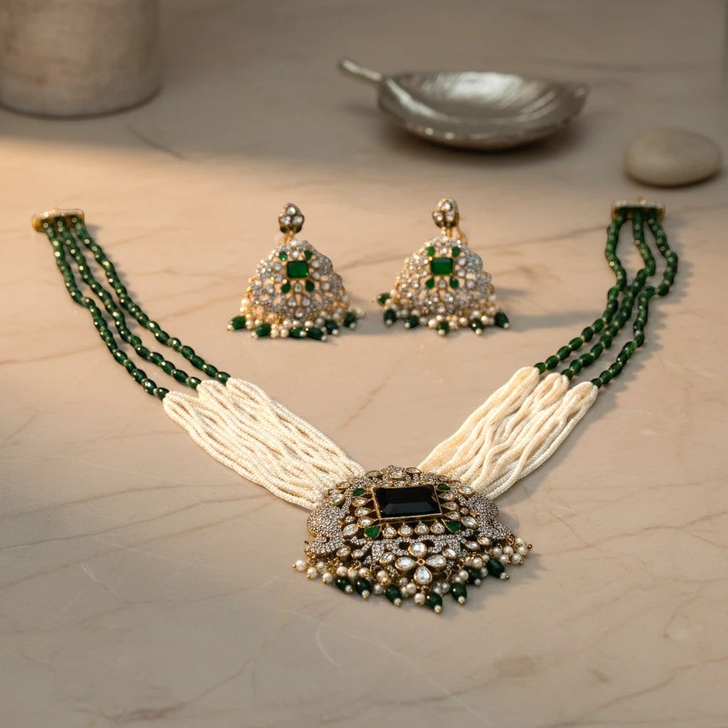 AVIRI emerald and pearl necklace and earring set with black onyx centerpiece and white stones.
