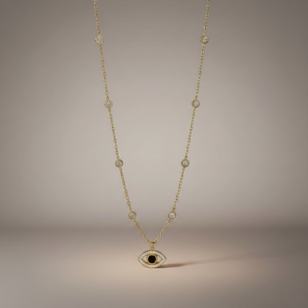 AVIRI gold-tone stainless steel necklace with evil eye pendant, cubic zirconia, and butterfly charms.