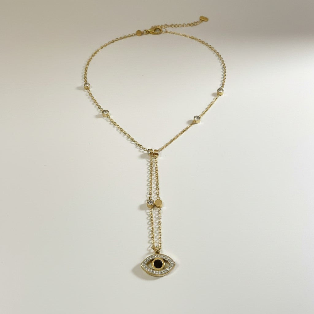 AVIRI gold-tone stainless steel necklace with evil eye pendant, cubic zirconia, and black enamel.