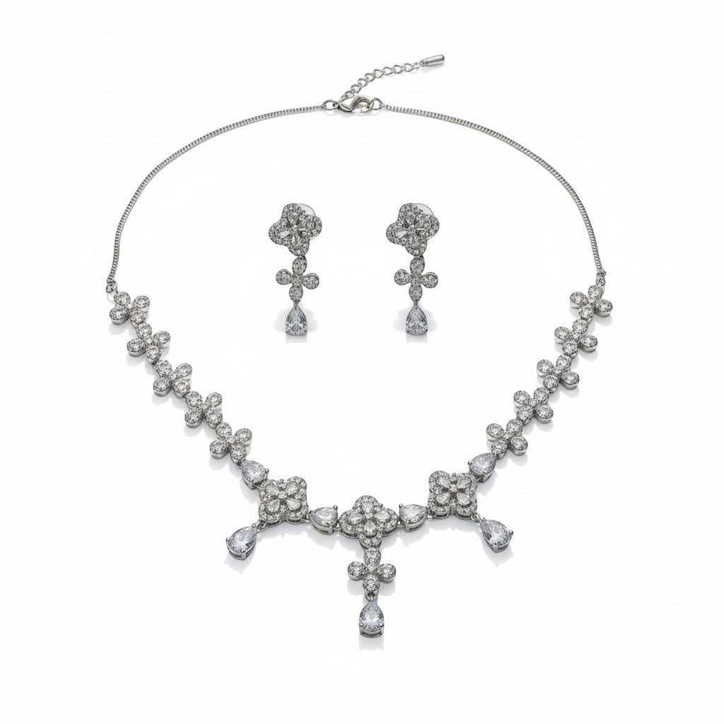 AVIRI floral necklace and earring set with cubic zirconia teardrop pendants and rhodium-plated finish.