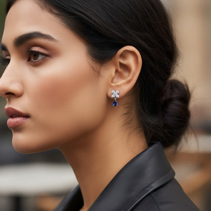 AVIRI floral drop earrings with pear-shaped blue gemstones and cubic zirconia in silver-tone metal.
