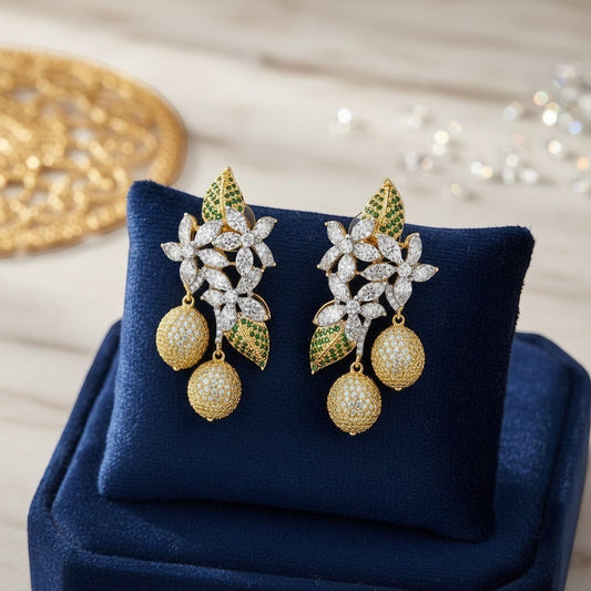 AVIRI floral drop earrings with cubic zirconia, green stones, and gold-tone spherical pendants.