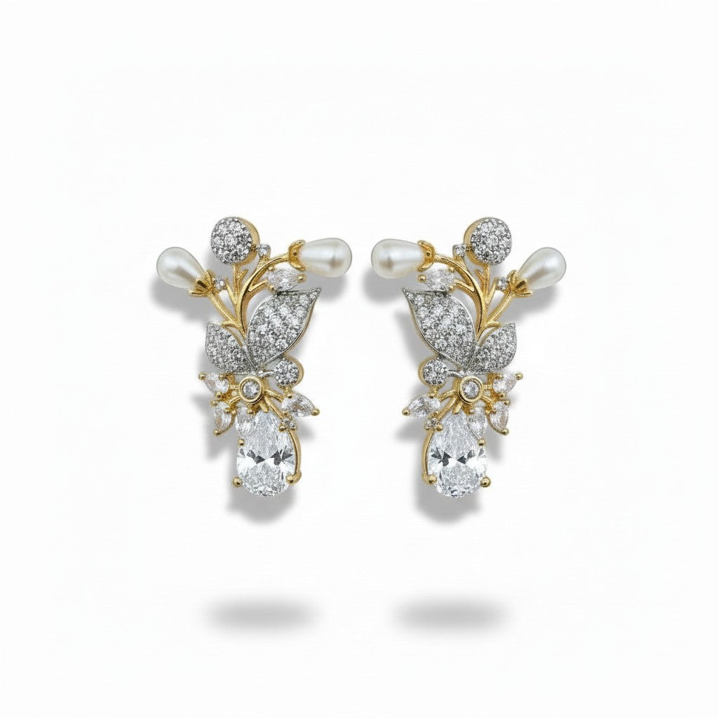 AVIRI floral brooch with pearls, cubic zirconia, and black onyx gemstone. Gold tone.