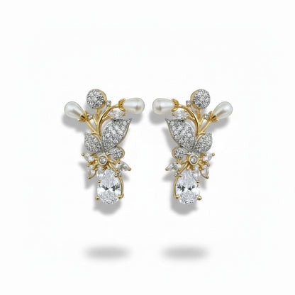 AVIRI floral brooch with pearls, cubic zirconia, and black onyx gemstone. Gold tone.