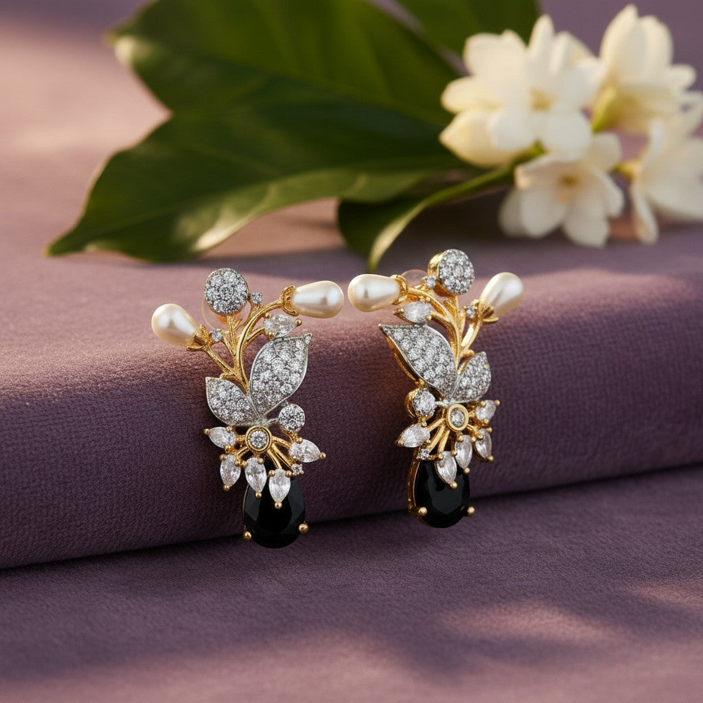 AVIRI gold-tone floral earrings with pearls, cubic zirconia, and black onyx gemstones.