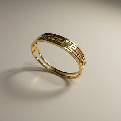 AVIRI gold-tone geometric bangle bracelet with cut-out detailing and cubic zirconia stones.