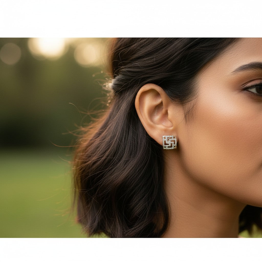 AVIRI silver-tone geometric stud earrings with cubic zirconia and openwork square design.