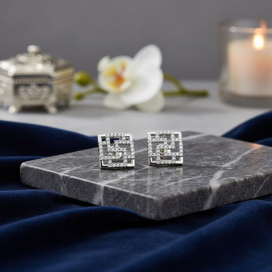 AVIRI silver-tone geometric stud earrings with cubic zirconia and openwork square design.