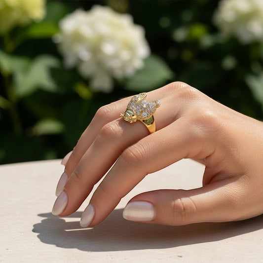 AVIRI gold-tone adjustable ring shaped like a bee, adorned with cubic zirconia stones.