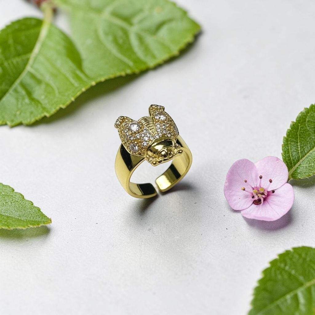 AVIRI gold-tone adjustable ring with cubic zirconia stones in a detailed bee design.