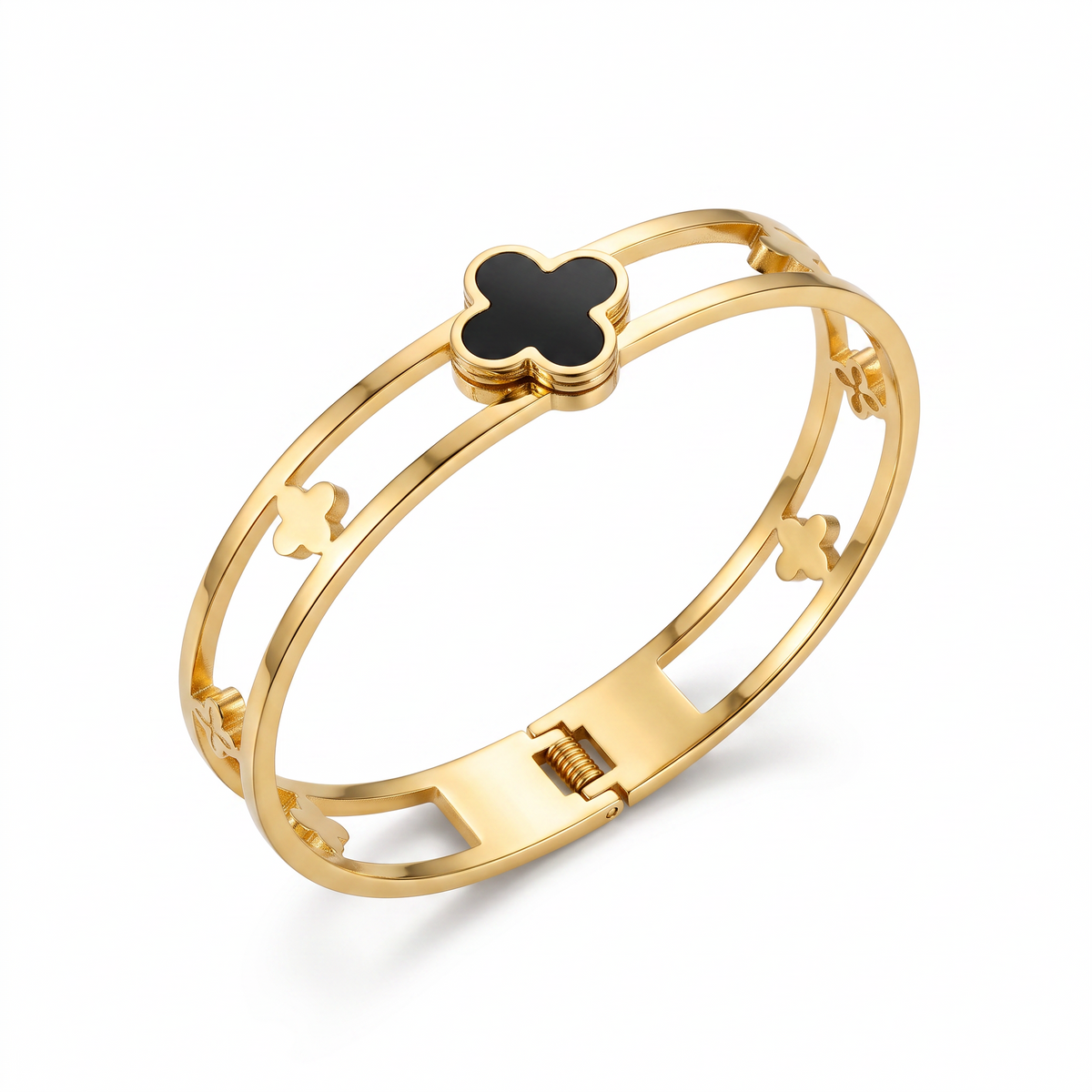 AVIRI gold-tone hinged bangle bracelet featuring a central black clover motif and delicate open-work clover details.