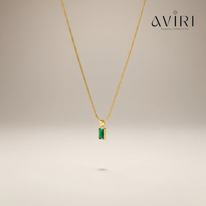AVIRI gold plated necklace with a rectangular emerald green pendant on a delicate chain. Anti-tarnish finish.