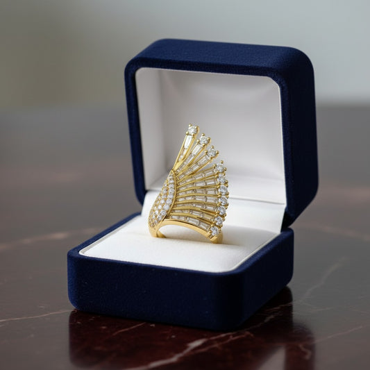 AVIRI gold fan-shaped ring with baguette and round-cut cubic zirconia stones. Statement jewelry.