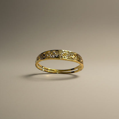 AVIRI gold-tone metal cuff bracelet with ornate filigree openwork design and polished finish.