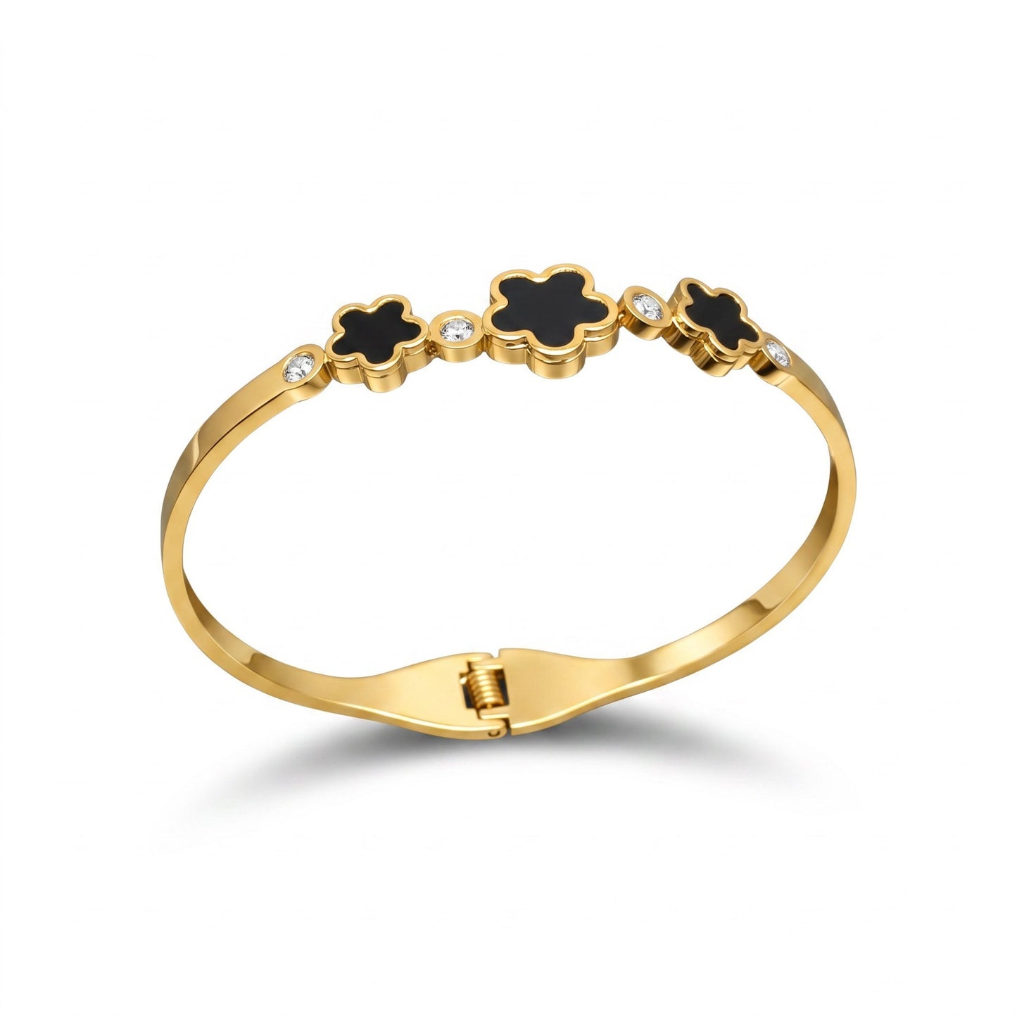 AVIRI gold-tone hinged bangle bracelet featuring black enamel flower motifs and sparkling cubic zirconia accents.