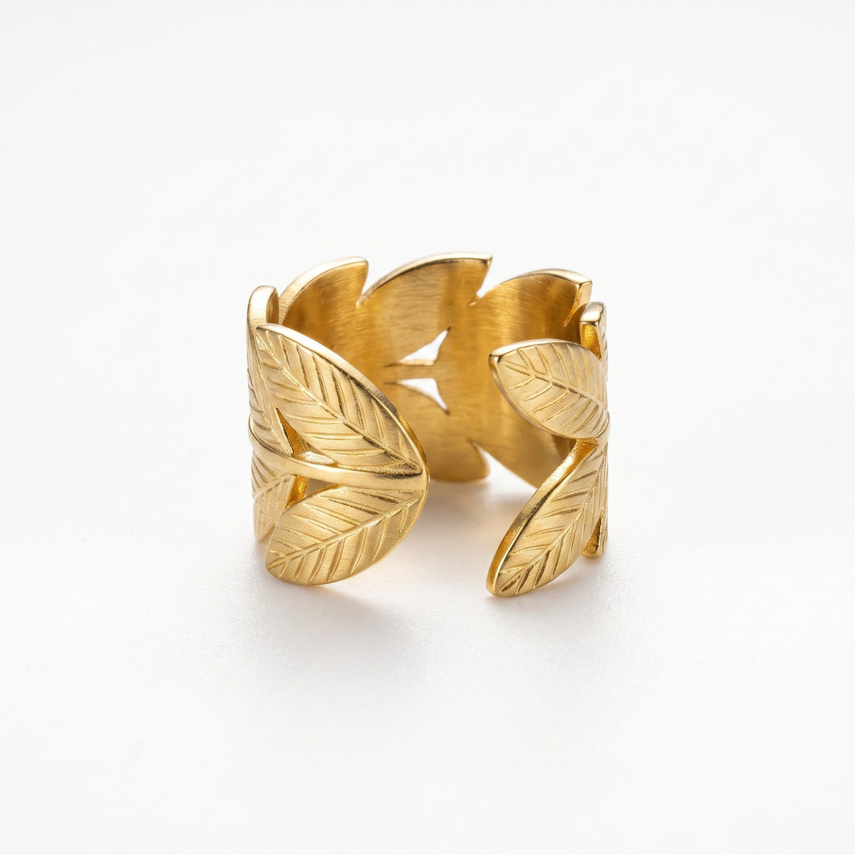 AVIRI gold-tone statement ring featuring a delicate brushed metal leaf pattern and an adjustable open-back design.