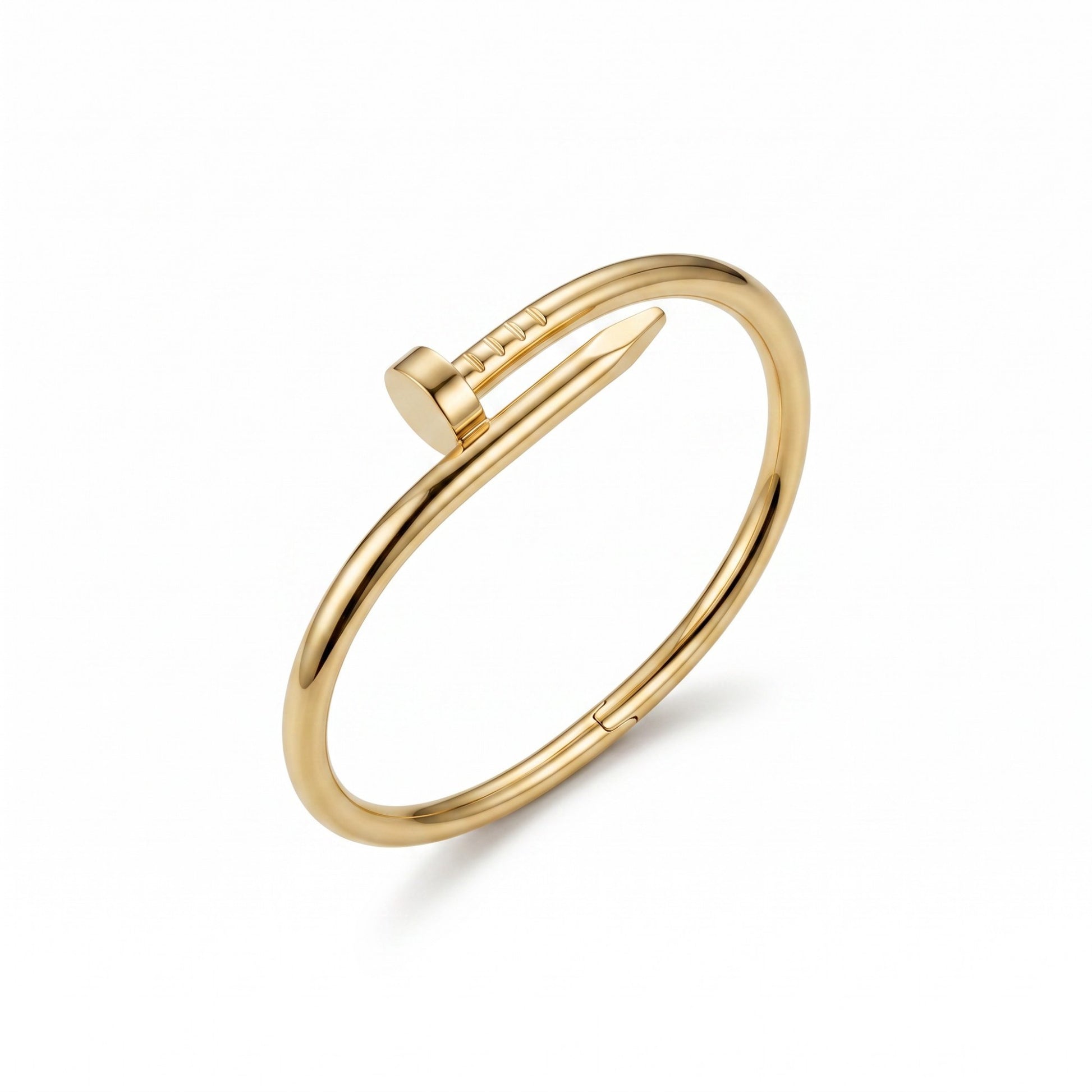 AVIRI gold-tone minimalist nail bangle bracelet with a polished finish and hinged closure on a white background.